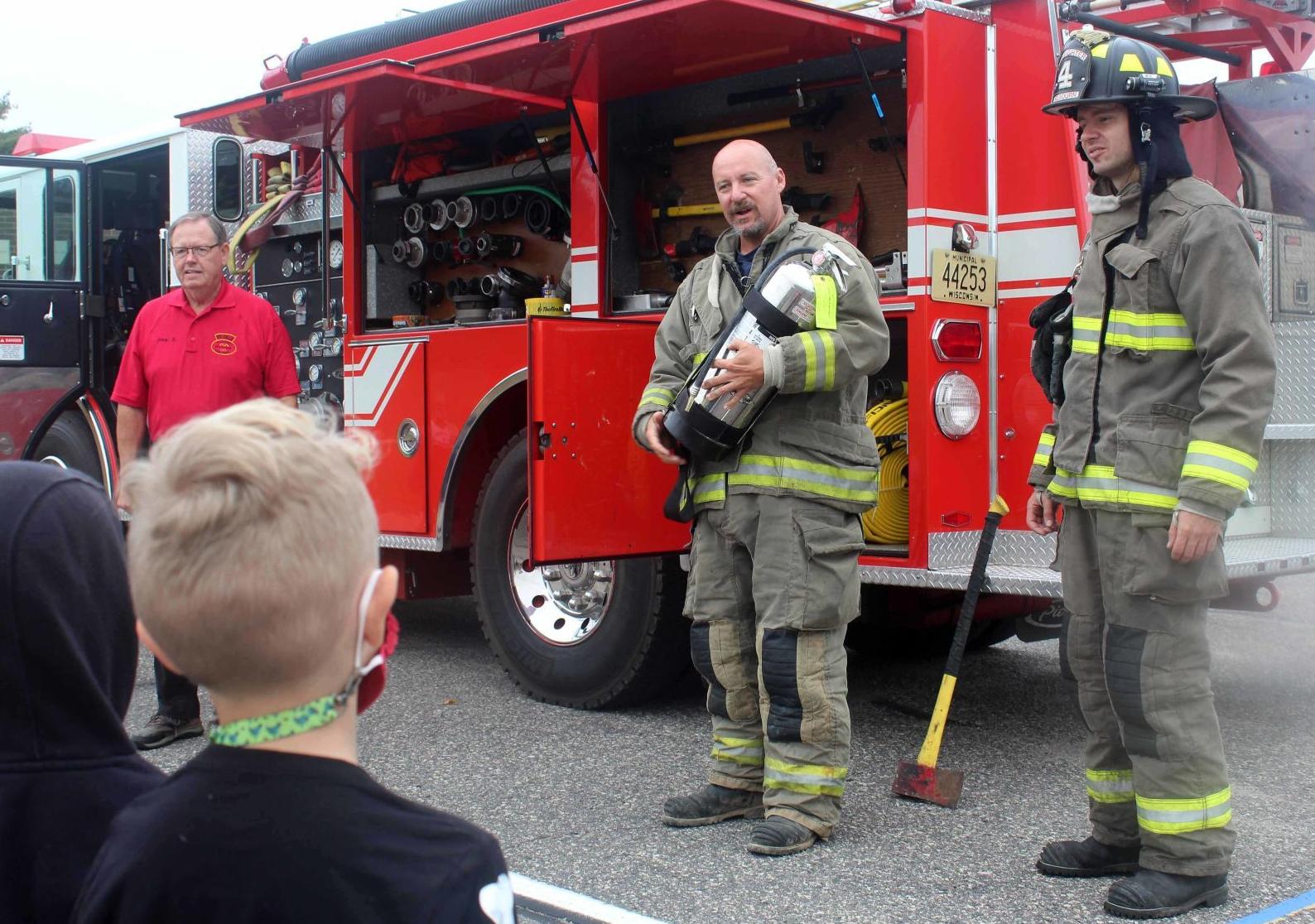 SHOWING FIREFIGHTER EQUIPMENT